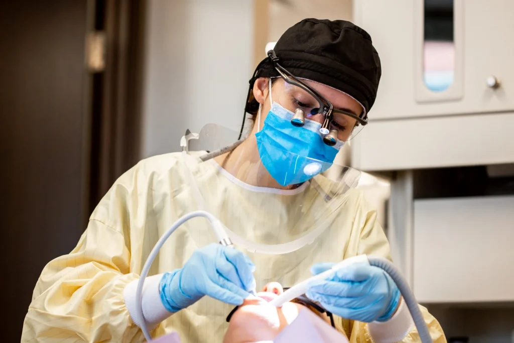 Hygienist working on patient